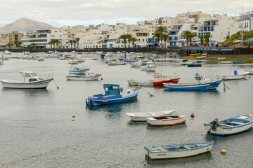Fototapeta na wymiar Boats moored at the port of Arrecife on Lanzarote in the Canary Islands, Spain .