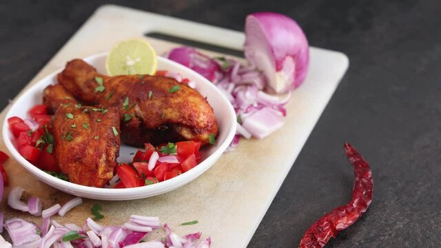 Indian Chicken fry leg piece, grilled chicken drumsticks hot and spicy meat dish barbecue roast  4K slow motion video footage in Kerala India. Pakistan Indian non veg food chicken 65 Ramadan, Easter