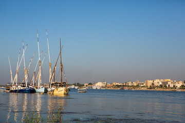 Fototapeta na wymiar Nile the longest river in Africa. Primary water source of Egypt. Landscape with clear water river.