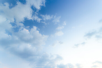 Blue sky background and white clouds soft focus, and copy space