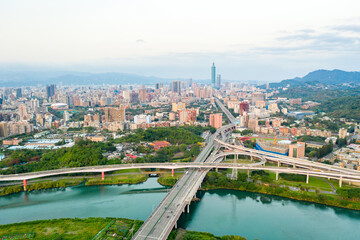 Fototapeta na wymiar Taipei City Aerial View - Asia business concept image, panoramic modern cityscape building bird’s eye view under sunrise and morning blue bright sky, shot in Taipei, Taiwan