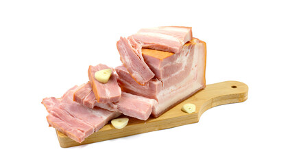 Smoked pork belly, bacon, ham on a wooden chopping board. White isolated background.