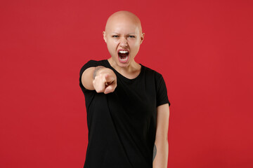 Young bald smiling caucasian indignant angry tattooed woman 20s without hair in basic casual...