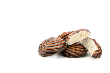 Chocolate-covered marshmallow close-up, isolated on a white background.Selective focus.