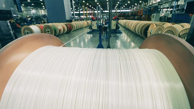 Large spool winds up electrical cable