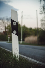 reflector post next to a rural raod