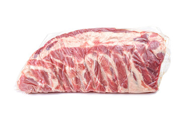 A piece of fresh pork meat in a vacuum package. Vacuum packaging raw fresh pork ribs isolated on a white background.