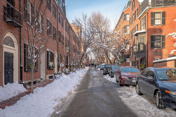 Cars parked on a plowed street in Beacon Hill in Boston