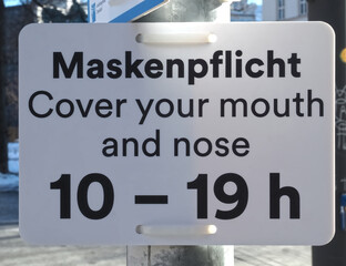 Street sign to remind people to wear masks on the street in Germany