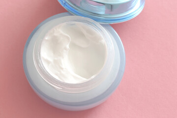face cream on pink background