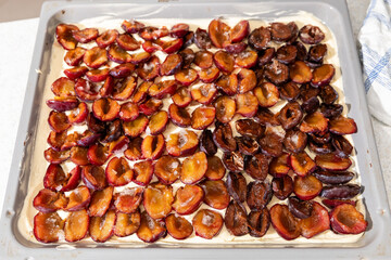 Baking plum cake in a kitchen