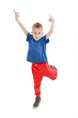Little cool hip-hop boy in dance. Isolated on white background

