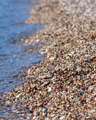 Colorful smooth pebbles on a sea beach. Background. Texture 
