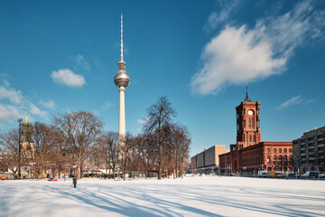 Berlin under snow. Panoramic image with television tower and Red Rathaus, or Old Town Hall in...