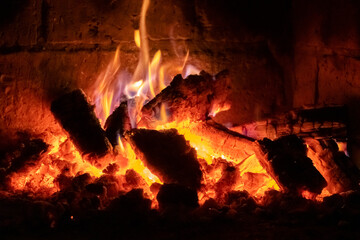A fire burns in a fireplace, Fire to keep warm