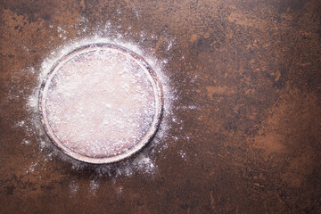 Flour food and pizza cutting board as bakery concept for homemade bread baking on table