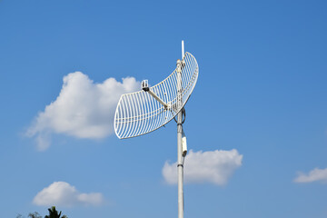 Outdoor internet wifi receiver and repeater installed on pole in long distant area of Thailand to receive signal from the wi-fi transmission tower and repeat it to the people's access points nearby.