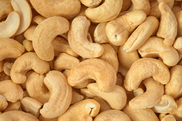 Cashew nuts closeup background, top view               