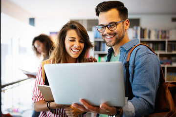 Students are studying together in library. Couple, study, technology, education love concept