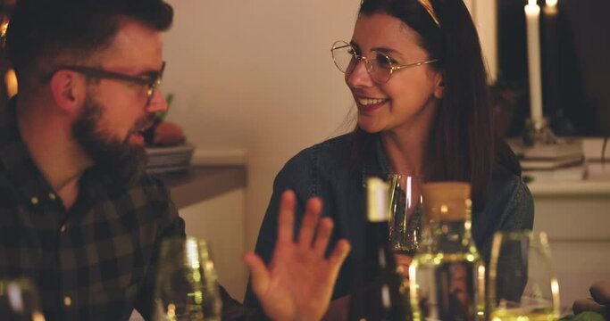 Two friends talking
during a dinner party
