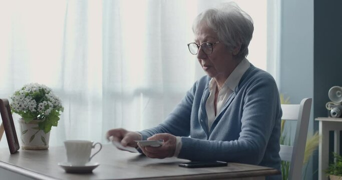 Senior woman playing solitaire