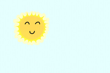 A cute nice sun with eyes and mouth (kawaii style illustration), high and shining on a blue sky. Plenty of copy-space.
