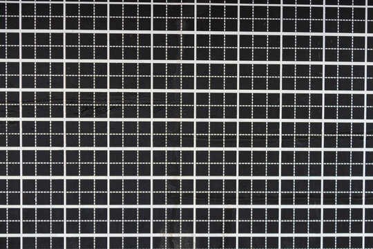 An old plotting grid with white lines on a black background.