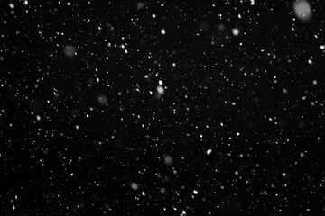 Real snow falls on black background, It is snowing, Ideal for blend layer screen add