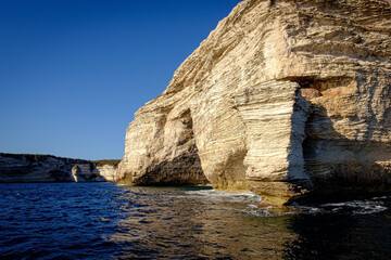 View from the water to the chalk cliffs of Bonifacio in Corse, France