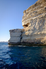 View from the water to the chalk cliffs of Bonifacio in Corse, France