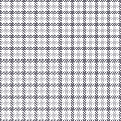 Abstract textile plaid pattern in grey and white for dress, jacket, coat. Seamless hounds tooth check plaid graphic art for spring and autumn casual everyday fashion fabric design. Dog tooth texture.