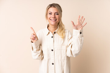 Blonde woman over isolated background counting six with fingers