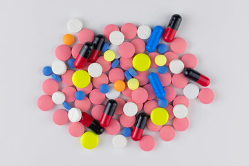 
Lots of pills on a white background. Top view.