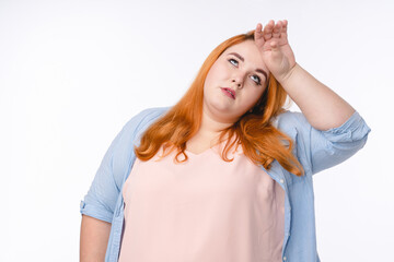 Tired plus size woman in casual outfit isolated over white background
