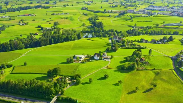 Drone rotating shot of a green idyllic landscape of Samstagern in Richterswil, Zurich, Switzerland