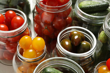 Fototapeta na wymiar Pickling jars with fresh vegetables, closeup view