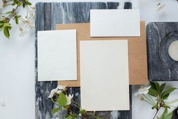 cards branding mockup template on dark marble background, with flowers. place for your design....