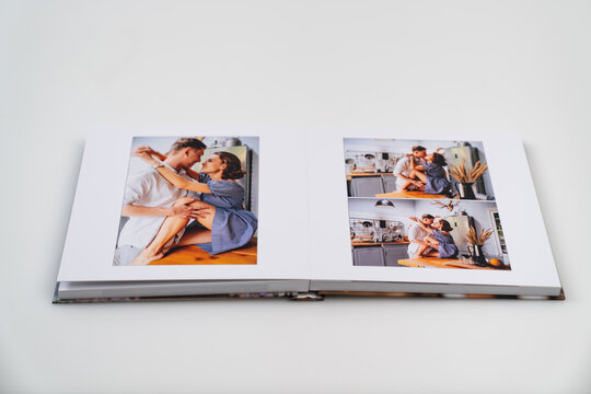 pages of photobook from photo shoots of a beautiful happy couple in the kitchen