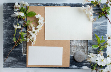 cards branding mockup template on dark marble background, with flowers. place for your design....