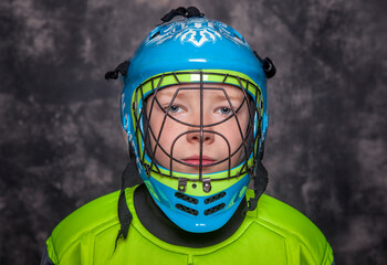 Obraz premium A young boy dressed as a hockey player.