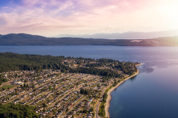 Aerial view of a small town, Powell River, during a sunny summer day. Sunset Sky Art Render....