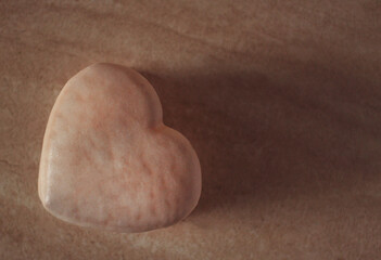 Fototapeta na wymiar Delicious soft chocolate gingerbread in the form of a heart with cinnamon