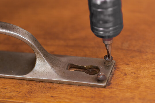 Removing Slotted Screw And Handle On Old Wooden Cupboard Door For Restoration