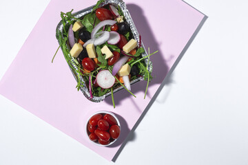 Healthy vegan take away salad in aluminum container