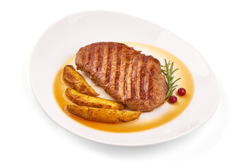 Grilled beef steak with potato wedges, isolated on white background