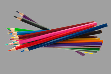 colored pencils on gray background. education concept. illustration of training.