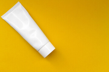 white plastic packaging on a yellow background