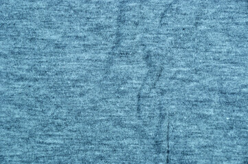 Background, texture, design. Blue jersey with pleats.