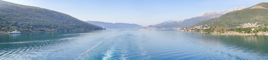 Panoramic view of Bay of Kotor from the sea surrounded by mountains in Montenegro, one of the most beautiful bay in the world