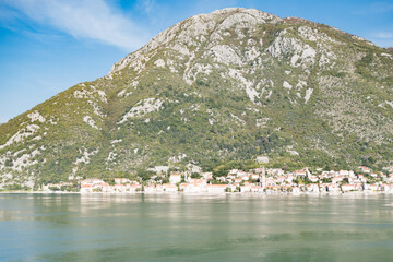 View of Bay of Kotor from the sea surrounded by mountains in Montenegro, one of the most beautiful...
